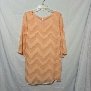 Peach V-neck, three-quarter sleeves dress, with a wavy chevron zigzag pattern
